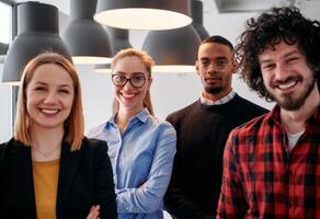 Diverse Business Team Standing United in Modern Office Ready for New Challenges. photo