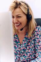 Friendly Call Center Agent Answering Incoming Calls with Headset Providing Remote Customer Service. photo