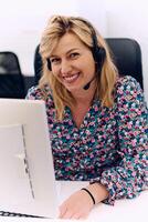 Friendly Call Center Agent Answering Incoming Calls with Headset Providing Remote Customer Service. photo