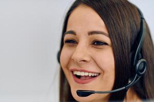 Friendly Call Center Agent Answering Incoming Calls with Headset Providing Remote Customer Service. photo