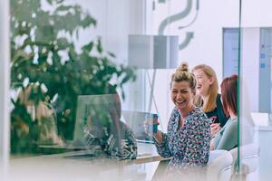Business Team of Women Discussing New Topics and Strategies to Improve Client Operations. photo