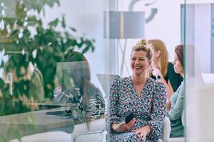 Business Team of Women Discussing New Topics and Strategies to Improve Client Operations. photo