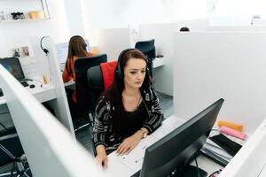 Friendly Call Center Agent Answering Incoming Calls with Headset Providing Remote Customer Service. photo