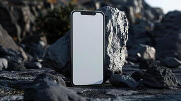 Phone and Rocks Mockup on Rugged Surface Dark Theme photo