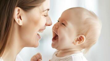 A joyful mother laughing with her baby, capturing a moment of pure happiness and connection in a bright, loving environment. photo