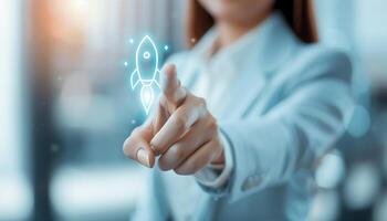 Businesswoman touching virtual rocket icon, representing innovation, startup, and technology. Business innovation and futuristic interface concept. photo