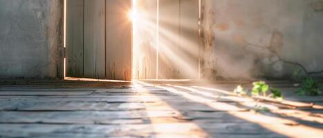 Sunlight streaming through a partially open wooden door, casting long shadows on an old wooden floor in an abandoned, rustic room. photo
