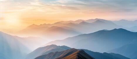 Breathtaking sunrise over misty mountains creating a serene, peaceful, and tranquil natural landscape scene perfect for relaxation and inspiration. photo