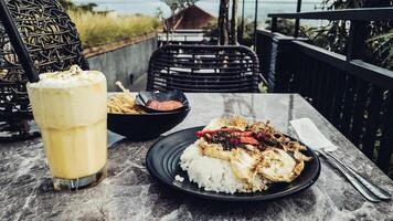 Pontianak egg rice with banana shake and enoki crispy mushroom photo