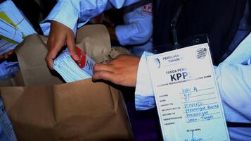 Voting atmosphere at TPS Tempat Pemungutan Suara Indonesian Polling Place photo
