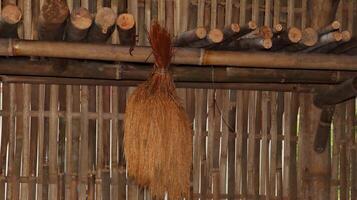 corn and rice hanging in a traditional Javanese kitchen photo
