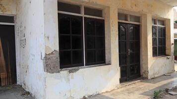 Old house, facade of a building ruin in old town photo