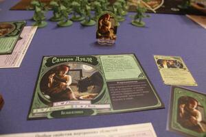 Hero card in the board game Unfathomable. Preparing the Player Tablet photo
