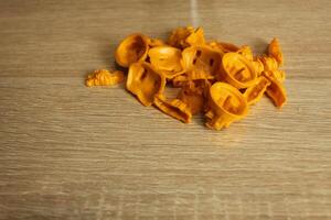 yellow game elements of the mipla of the board game catan on a light beige background photo