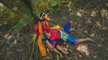 Traditional attire in a forest setting video