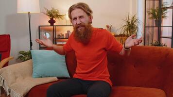 Bearded ginger man asking why, what reason of failure demonstrating disbelief irritation by troubles video