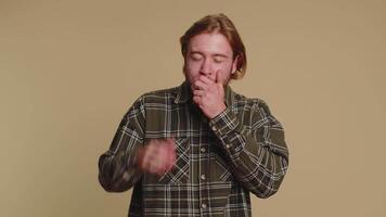 Tired man yawning sleepy inattentive, feel somnolent lazy bored gaping suffering from lack of sleep video