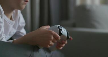 Child Playing with White Game Controller video