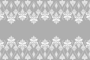 White damask seamless pattern of floral and leaf motifs on grey background vector