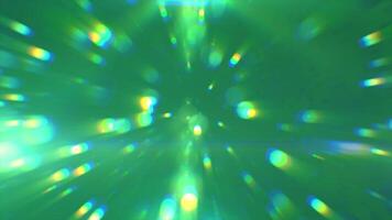Abstract green glowing background with flying balls and circles of blurred festive bokeh particles, in high quality 4k, motion design video