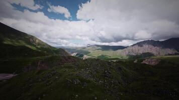 Aerial view from a sports FPV drone. A quadcopter is chasing a wild great mountain eagle high in the mountains. Wildlife of the sky video