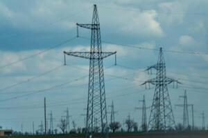 High voltage towers with sky background. Power line support with wires for electricity transmission. High voltage grid tower with wire cable at distribution station. Energy industry, energy saving photo