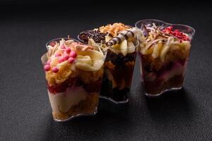 Delicious nutritious vegan dessert trifle with berries, cheese cream photo