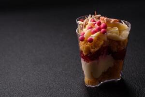 Delicious nutritious vegan dessert trifle with berries, cheese cream photo