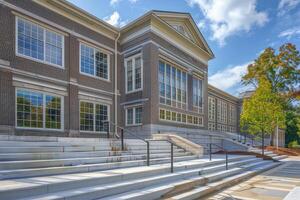 Exterior of a modern school building with stairs going up and down photo
