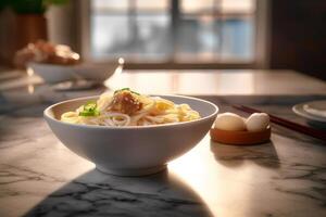 Japanese udon noodles in a white bowl on a marble table in a restaurant photo
