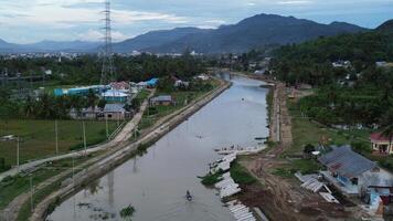 Aerial view of river and village in the evening in Gorontalo, Indonesia photo