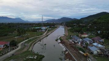 Aerial view of river and village in the evening in Gorontalo, Indonesia photo