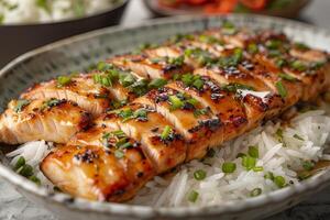 Grilled teriyaki chicken with soy sauce and sesame seeds. closeup photo