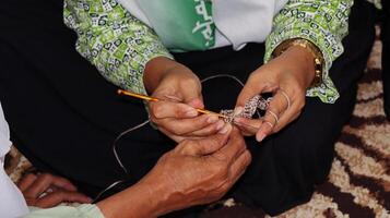 Female hands close-up. Handmade. Colored yarn and knitting needles. photo