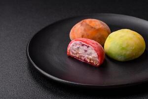 Delicious colorful asian mochi sweets with rice dough shell photo