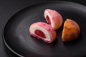 Delicious colorful asian mochi sweets with rice dough shell photo