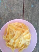 keripik pisang or banana chips is one of type traditional dry snack from indonesia photo