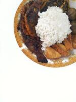 A closeup view of grilled white fish, in a restaurant or kitchen setting. photo