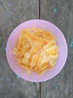 keripik pisang or banana chips is one of type traditional dry snack from indonesia photo