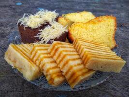 Kue Lapis or Kue Pepe or Rainbow sticky layer cake, Indonesian traditional dessert made from rice flour and coconut milk, steamed layer by layer photo