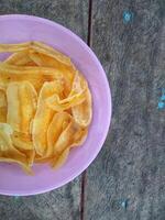 keripik pisang or banana chips is one of type traditional dry snack from indonesia photo