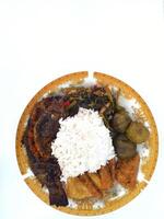 A closeup view of grilled white fish, in a restaurant or kitchen setting. photo