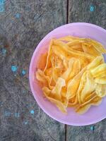 keripik pisang or banana chips is one of type traditional dry snack from indonesia photo