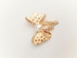 Accessories shaped like butterflies and melodies in yellow and white with imitation gems are suitable for use at events and add to the elegance of women. on white background photo