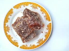 Ongol Ongol, Indonesian Traditional Snacks, made from Arrowroot Flour and Brown Sugar, on white background photo