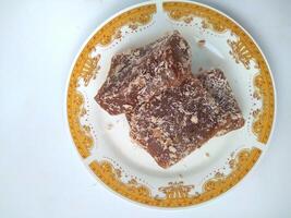 Ongol Ongol, Indonesian Traditional Snacks, made from Arrowroot Flour and Brown Sugar, on white background photo