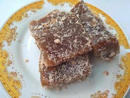 Ongol Ongol, Indonesian Traditional Snacks, made from Arrowroot Flour and Brown Sugar, on white background photo