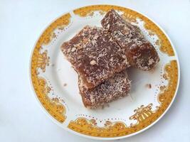 Ongol Ongol, Indonesian Traditional Snacks, made from Arrowroot Flour and Brown Sugar, on white background photo