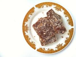 Ongol Ongol, Indonesian Traditional Snacks, made from Arrowroot Flour and Brown Sugar, on white background photo