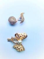 Accessories shaped like butterflies and melodies in yellow and white with imitation gems are suitable for use at events and add to the elegance of women. on white background photo